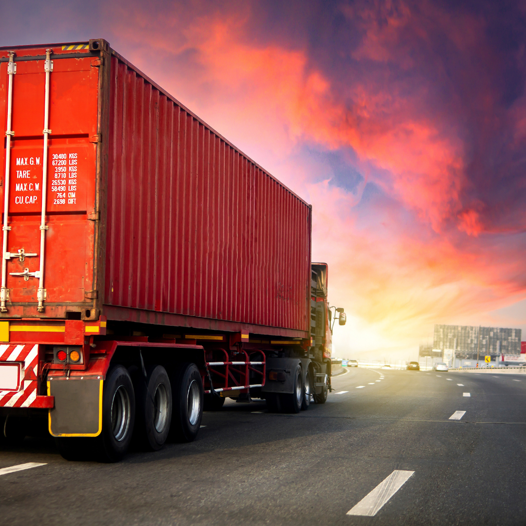 Freight truck driving into the sunset